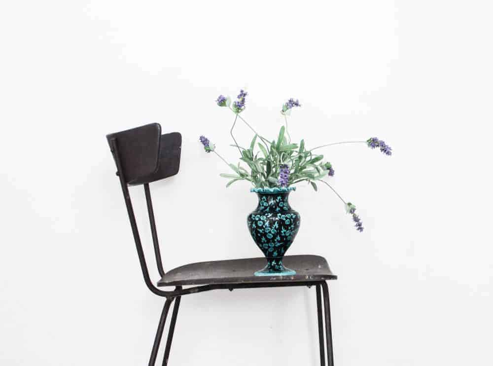 How To Declutter Your Home Fast: 35 Quick Tips That Actually Work 7 vase on chair
