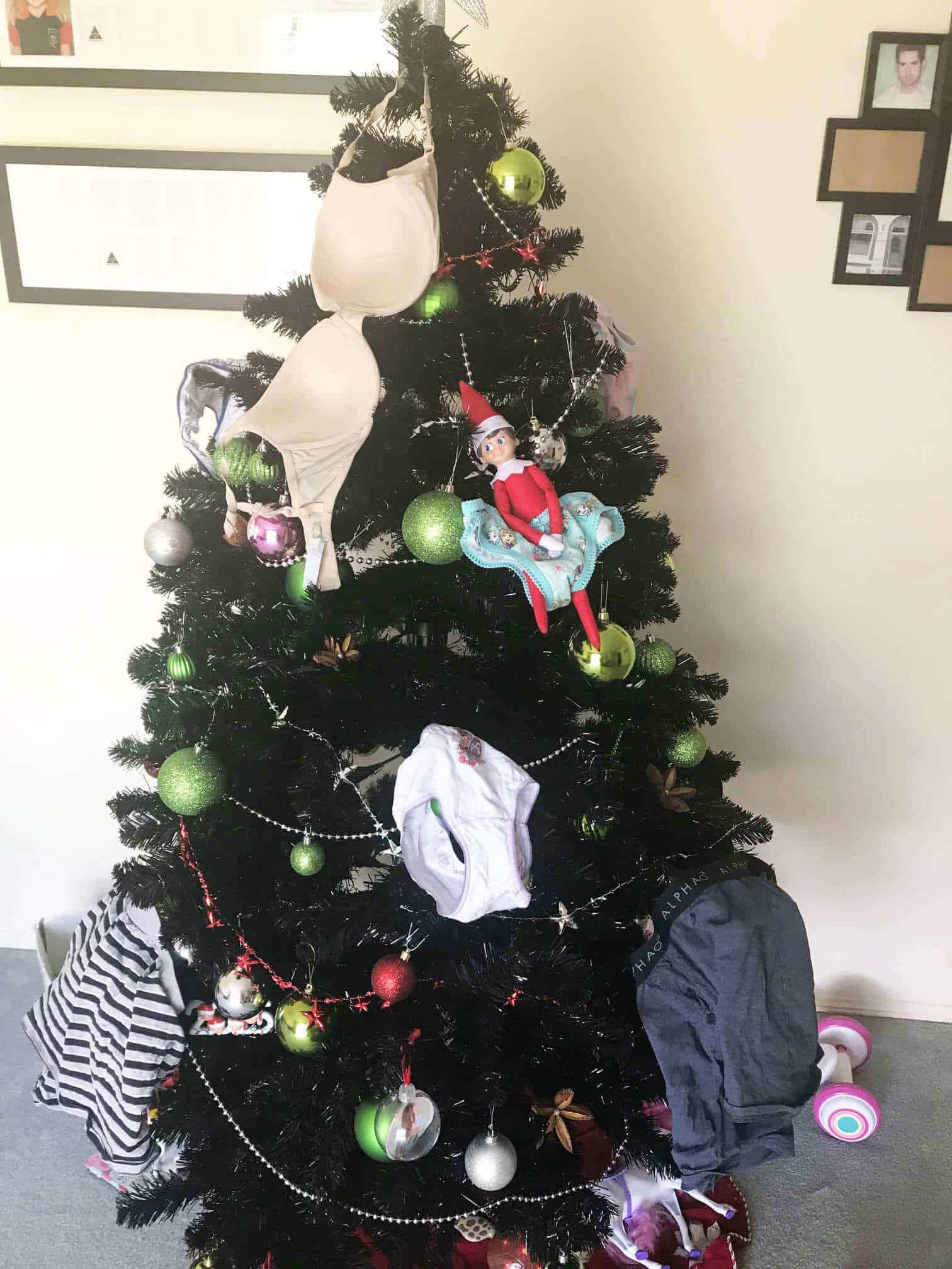 Creative & Easy Elf On The Shelf Ideas (50+ Ideas) 27 Elf stolen underpants on tree