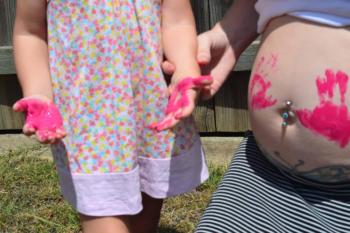 Gender reveal with paint handprints