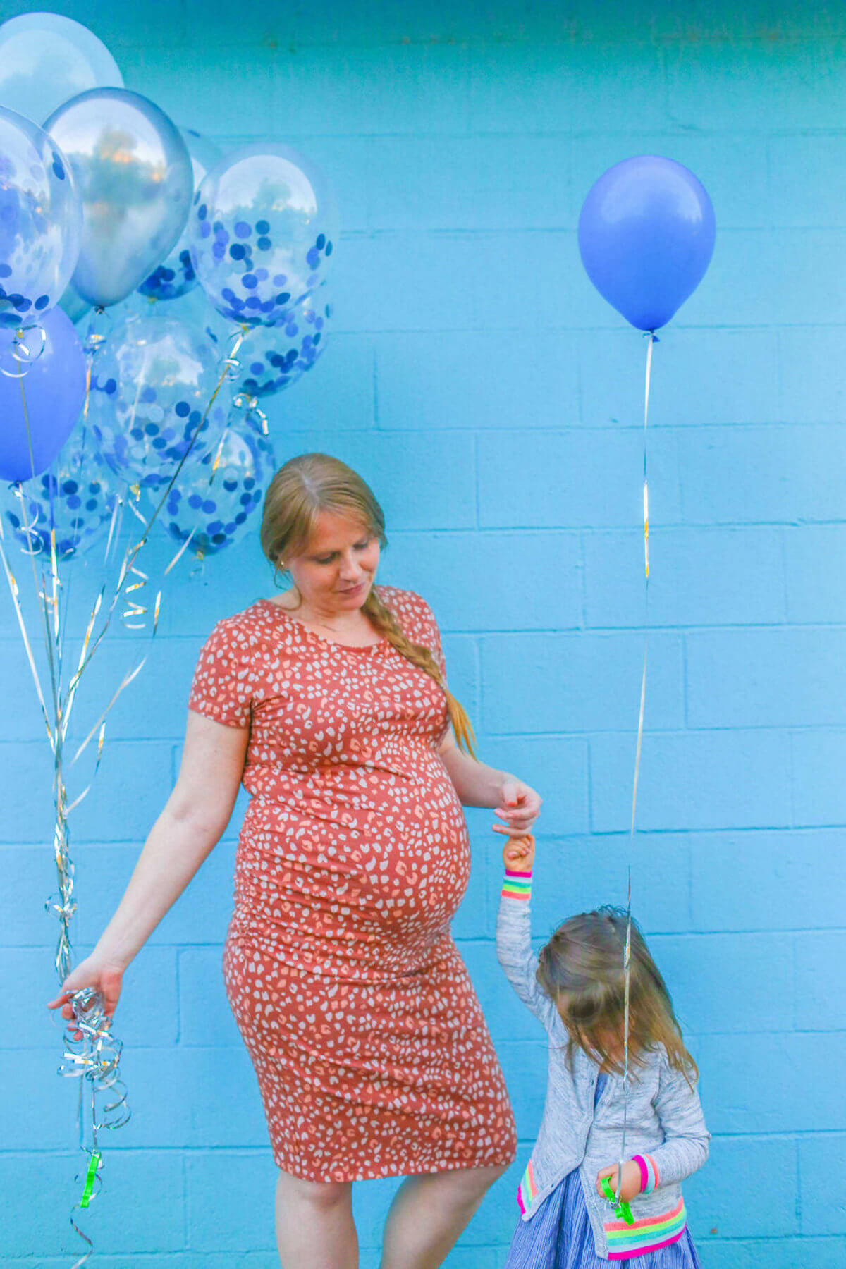 Gender reveal with blue balloons