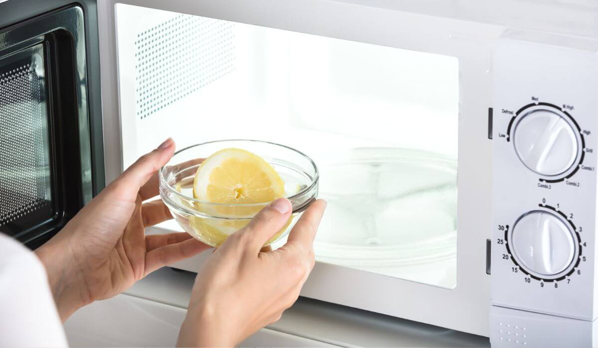 Putting bowl of water and lemon in microwave