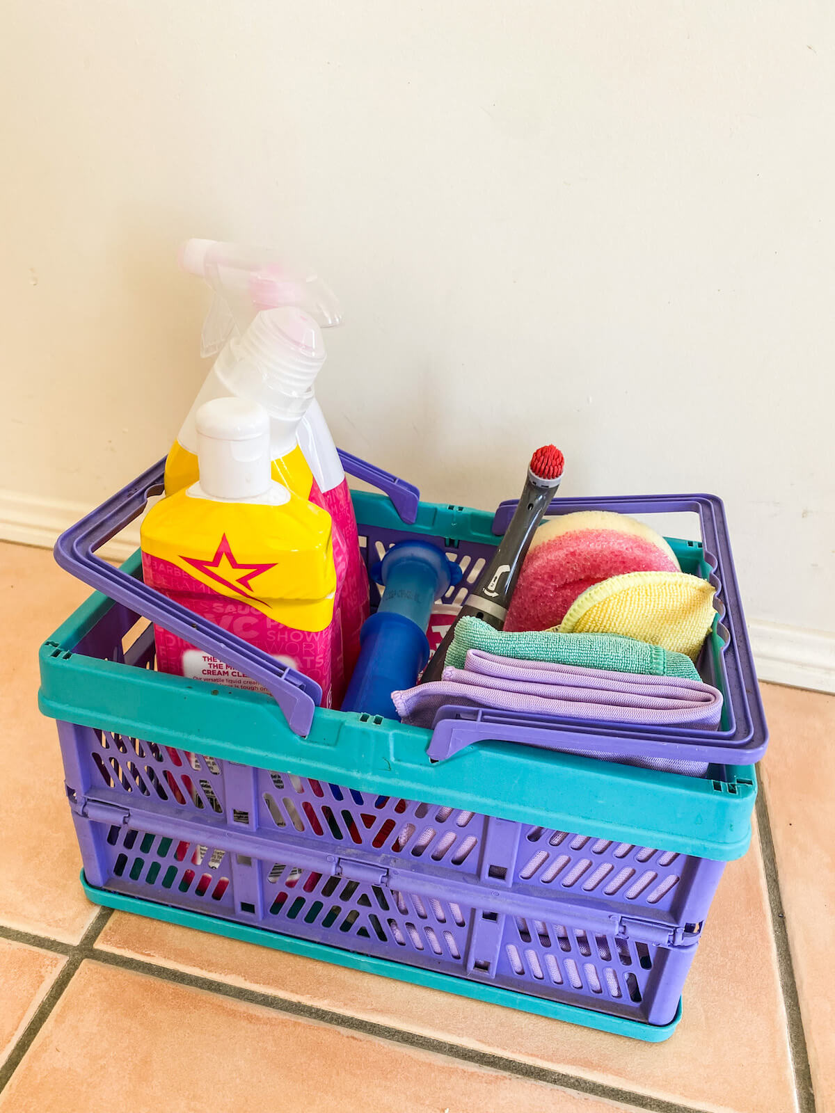 Home cleaning caddy full of cleaning supplies