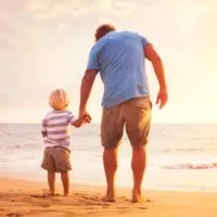 father and son at beach