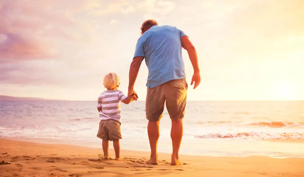 father and son at beach