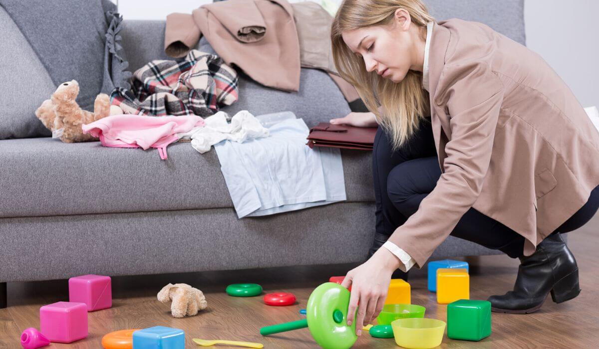 Woman tidying messy living room