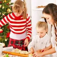 3 girls decorating christmas cookies