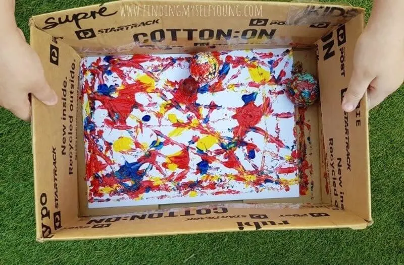 ball painting inside a box