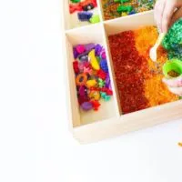 sensory tray with rainbow rice
