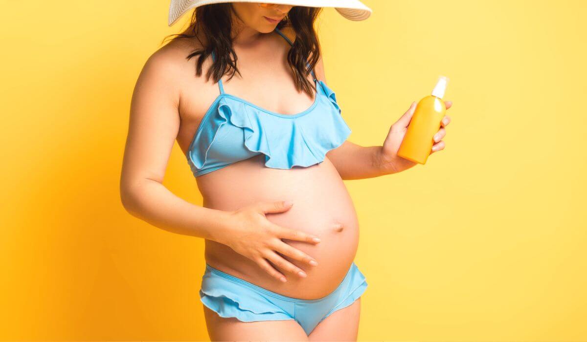 Woman in bikini while pregnant