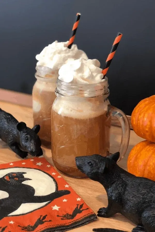Salted caramel apple cider float with plastic rats