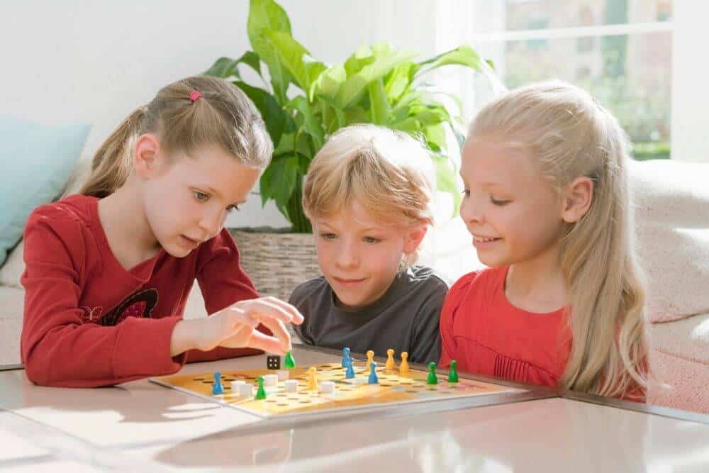 Kids playing board game