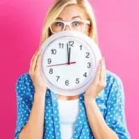 5 minute daily declutter habit woman with clock