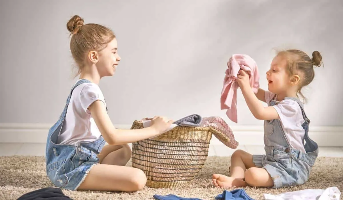 Kids folding laundry together