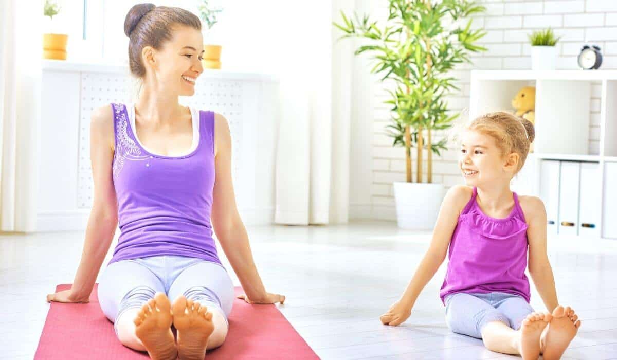 Mother and daughter doing yoga