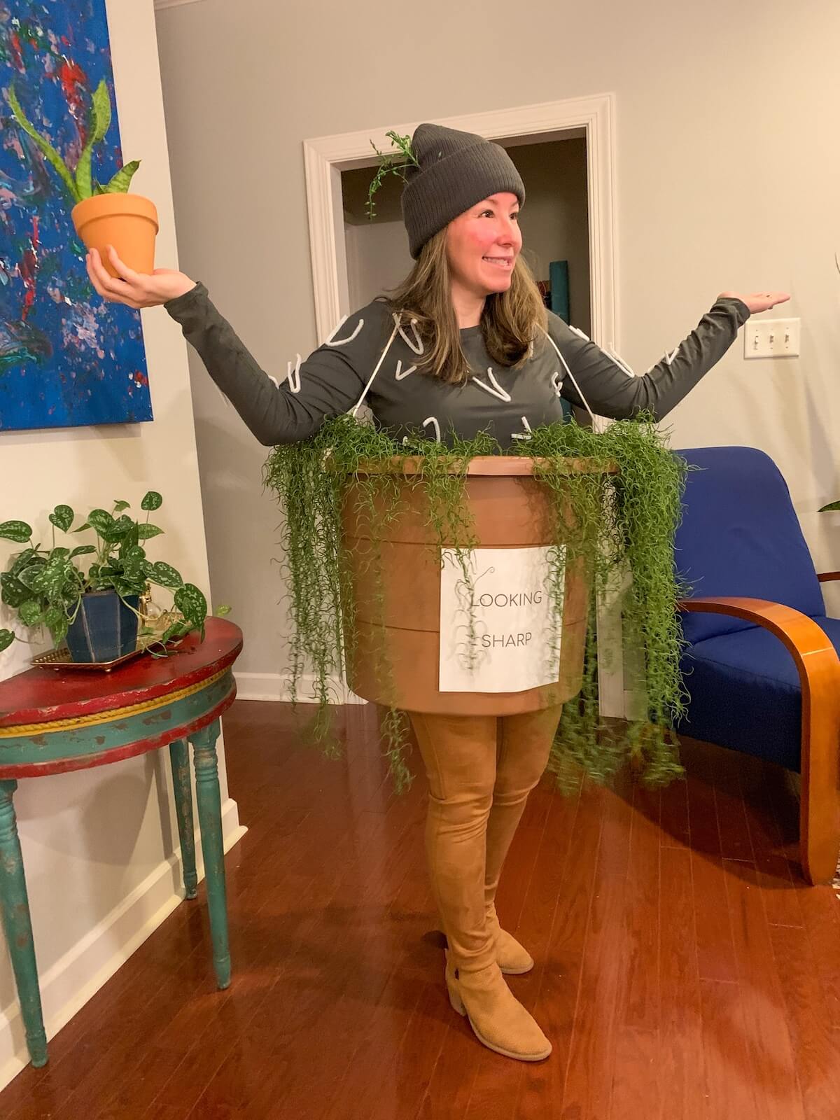 Woman dressed up as a potted cactus for halloween.
