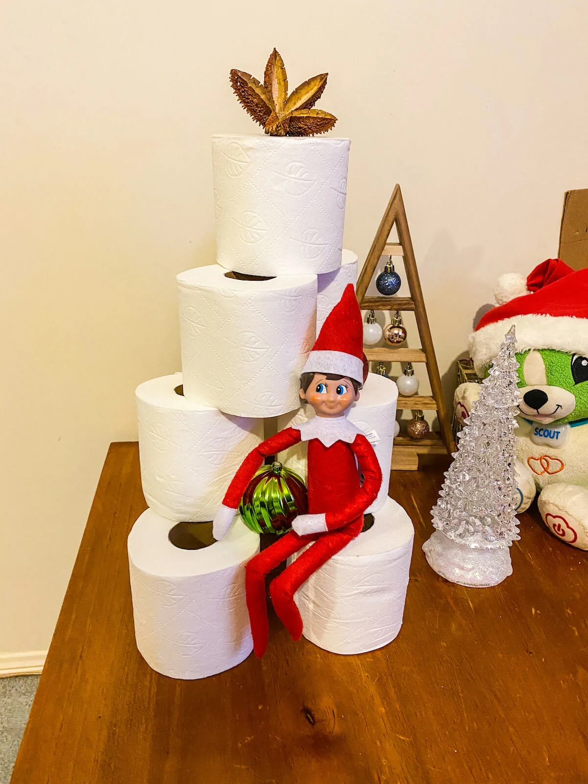 Elf making toilet paper christmas tree