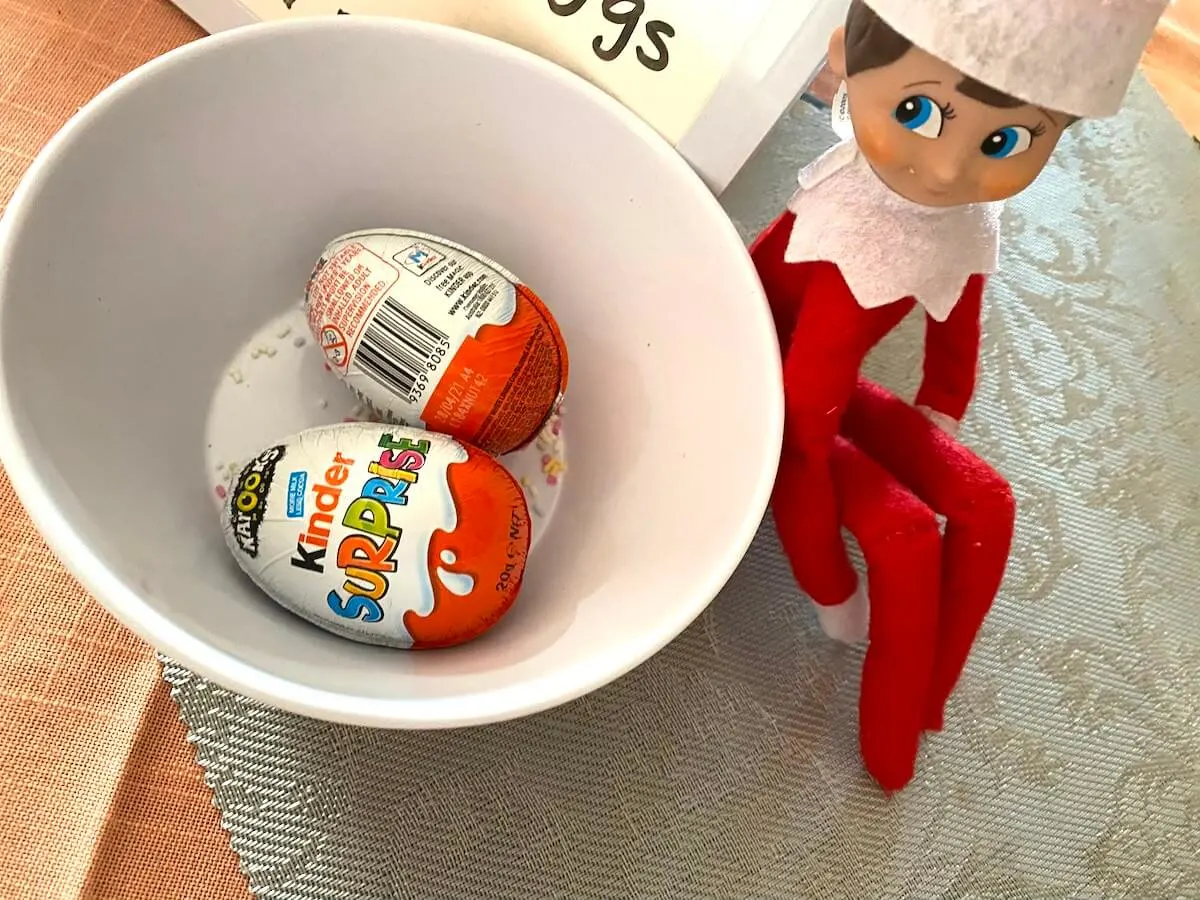 Elf with kinder surprise eggs