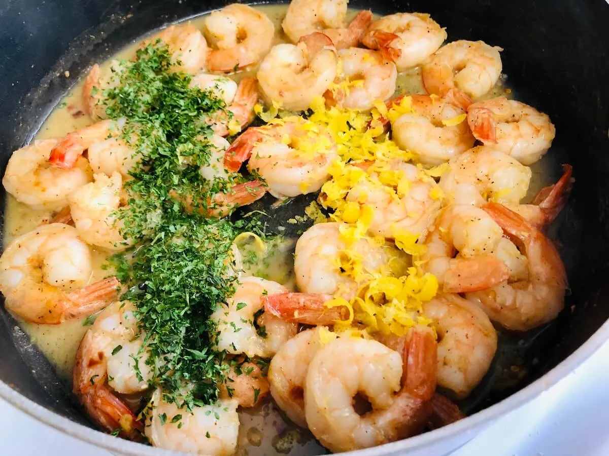 Prawns in skillet with ingredients