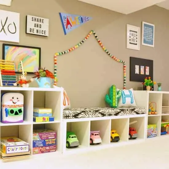 Playroom with 3 kallax units to create wall shelving