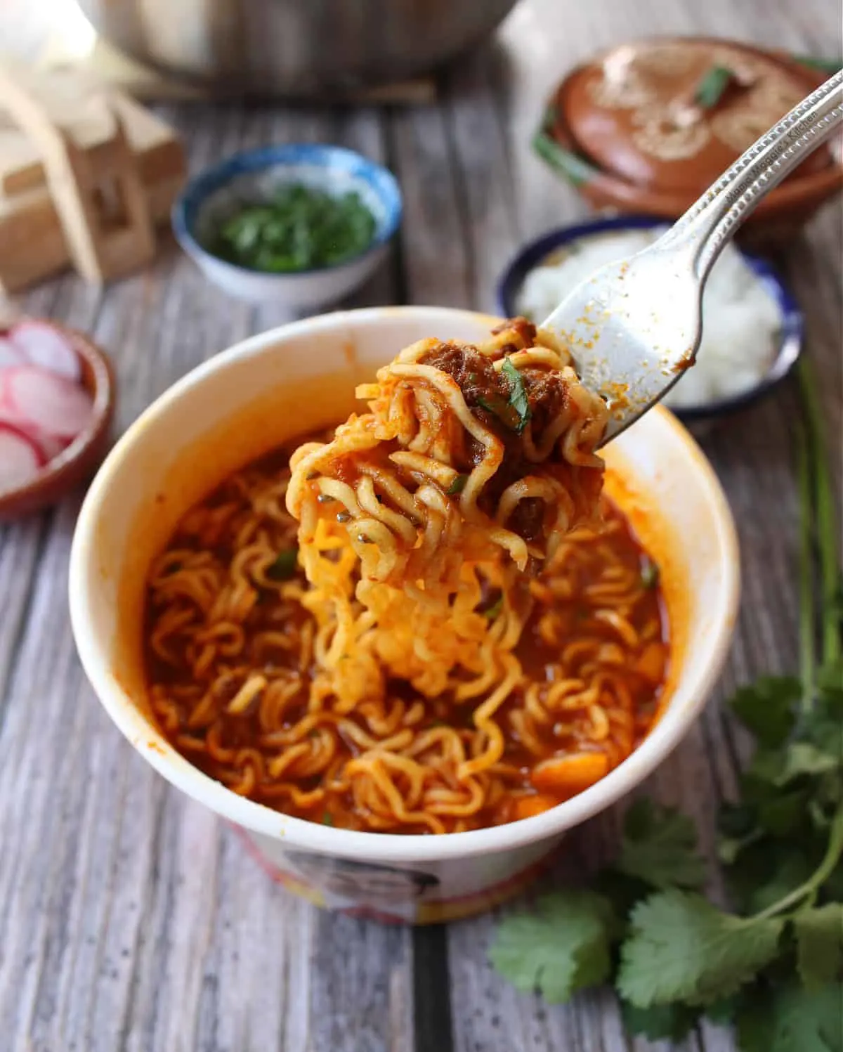 Birria ramen in a bowl with spoon