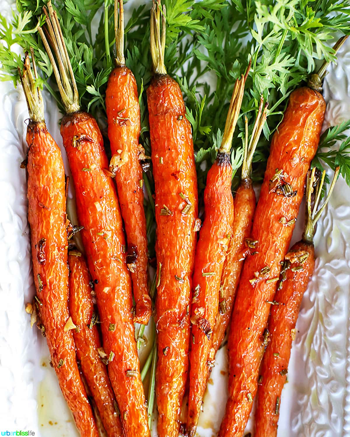 Garlic rosemary carrots roasted on platter
