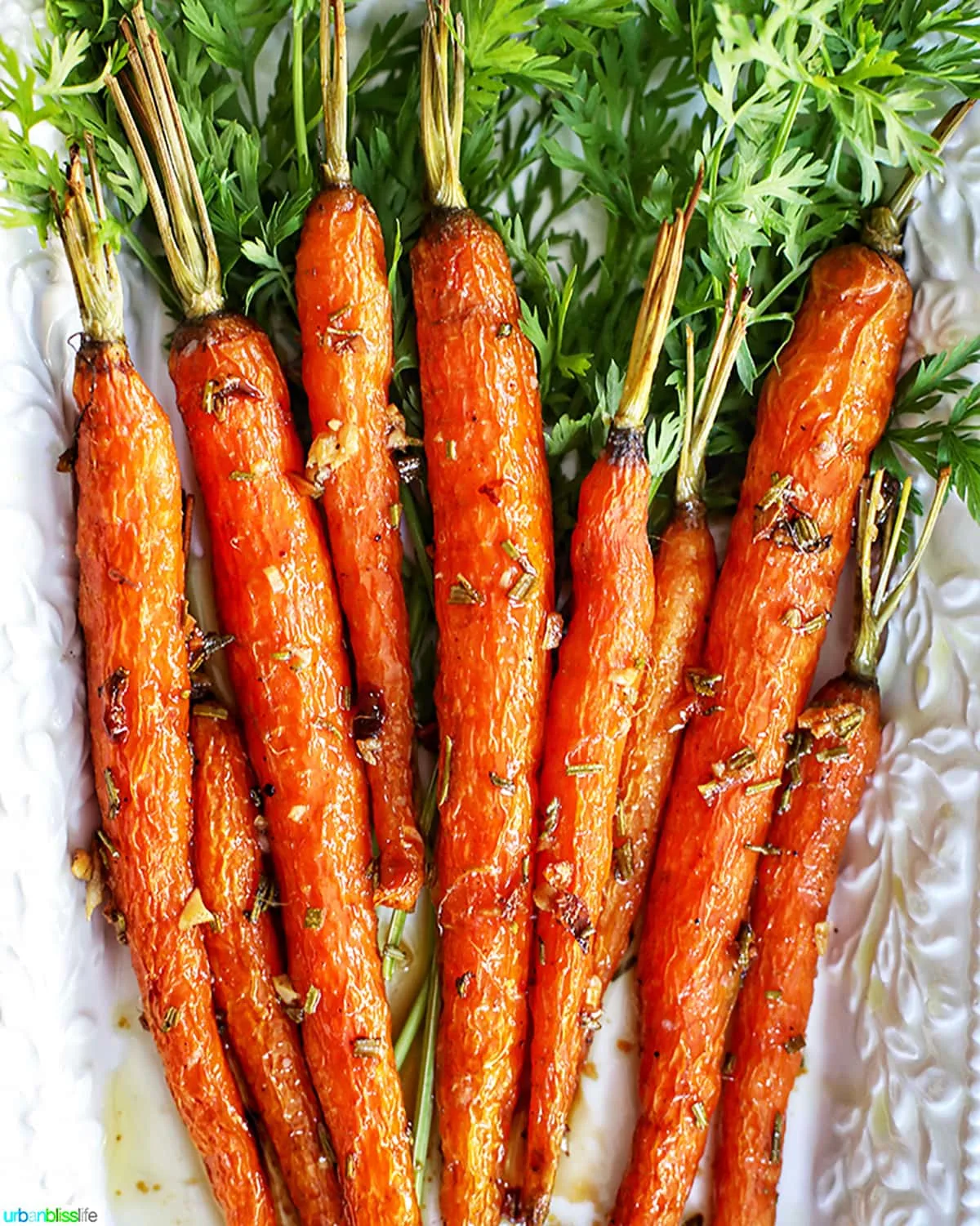 Garlic rosemary carrots roasted on platter