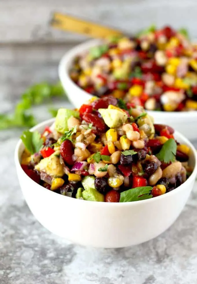 Mexican three bean salad stacked high in a bowl