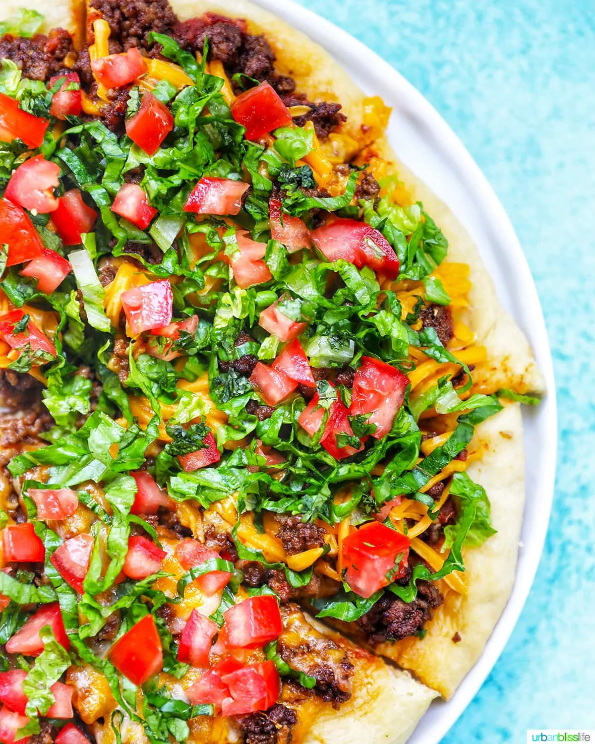 Taco pizza on serving tray