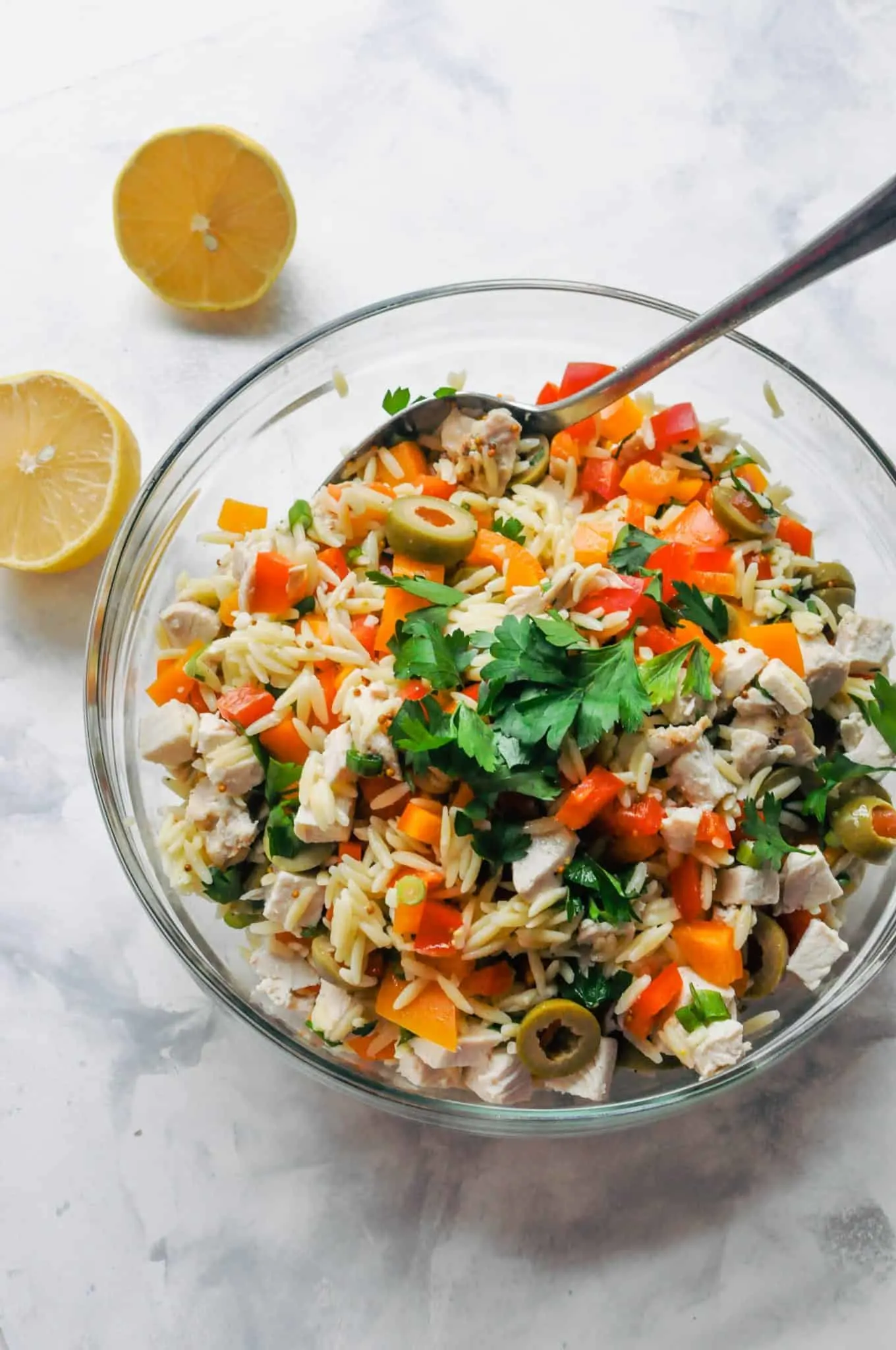 Orzo chicken salad in a glass bowl