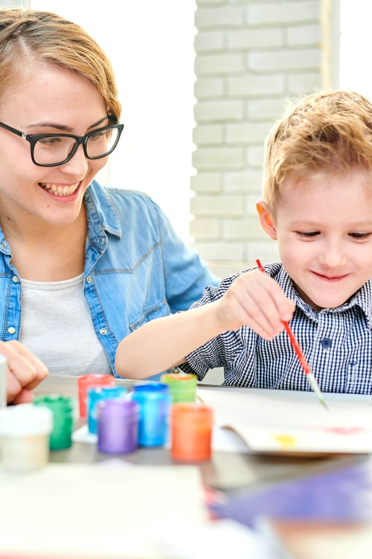 Mother and son painting together