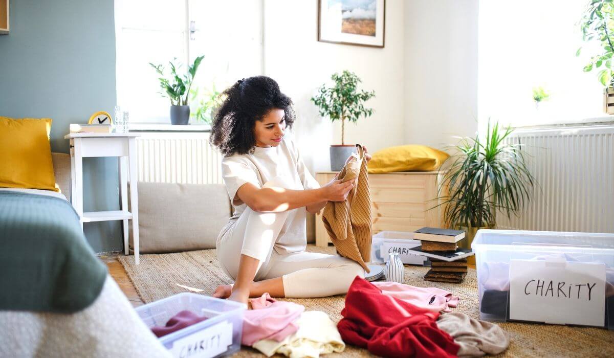 Woman decluttering clothing