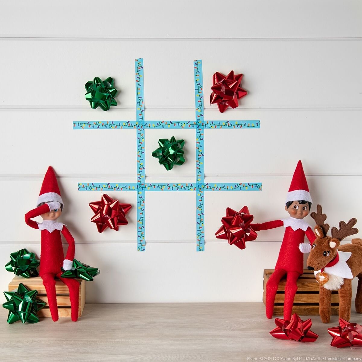 Elf on the shelf playing noughts and crosses