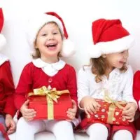 kids laughing in Christmas outfits