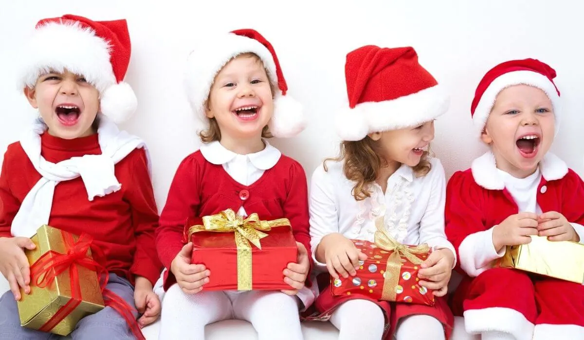 Kids laughing in christmas outfits