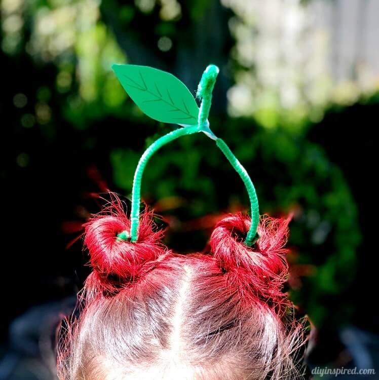 Cherry hair style with pipe cleaner stems.