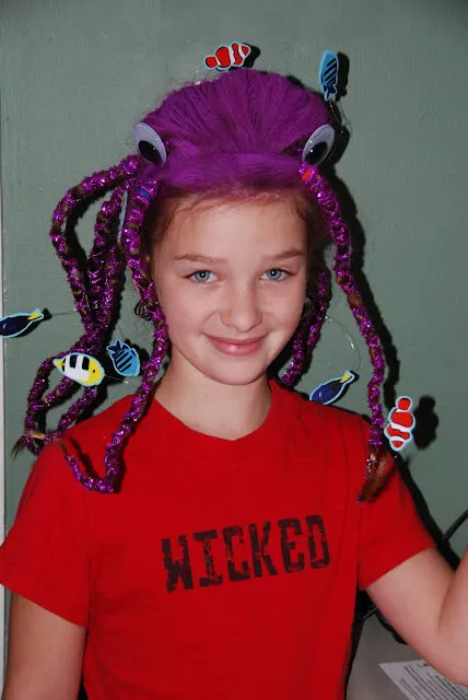 Octopus hair style with fish flaoting around, coloured purple.