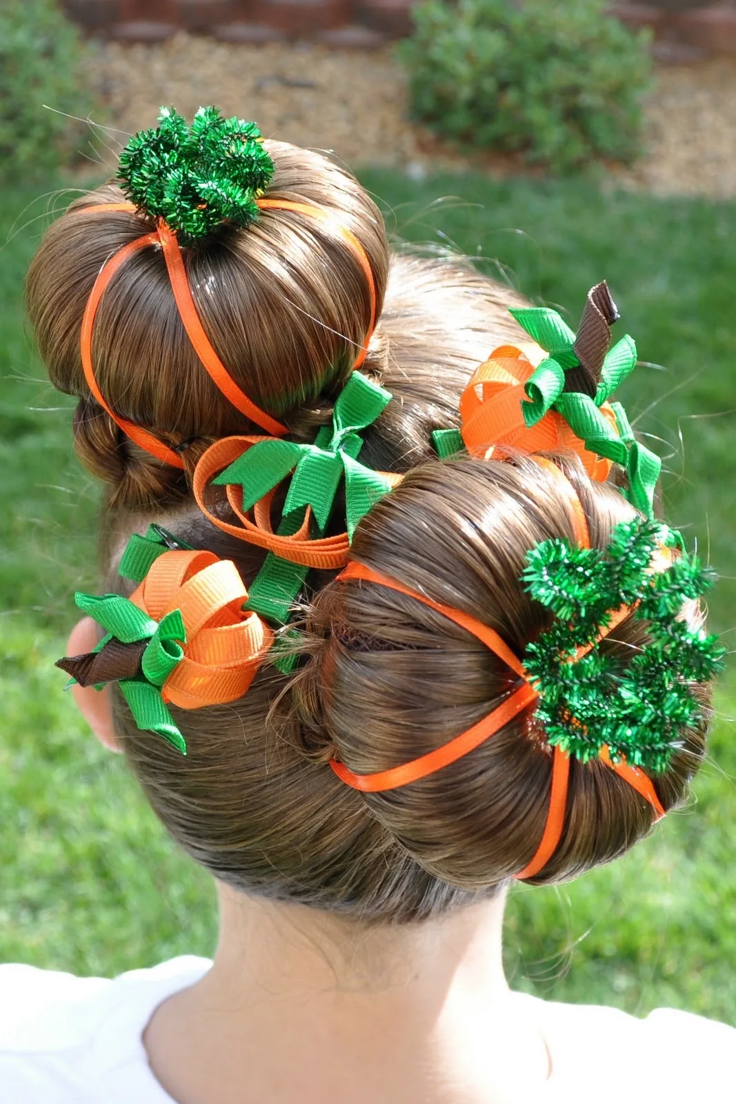 Double pumpkin buns for a halloween hairstyle or crazy hair day.