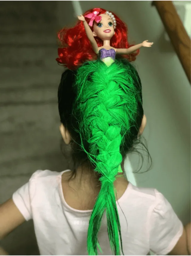 The little mermaid hairstyle with an ariel barbie doll and green hairspray.