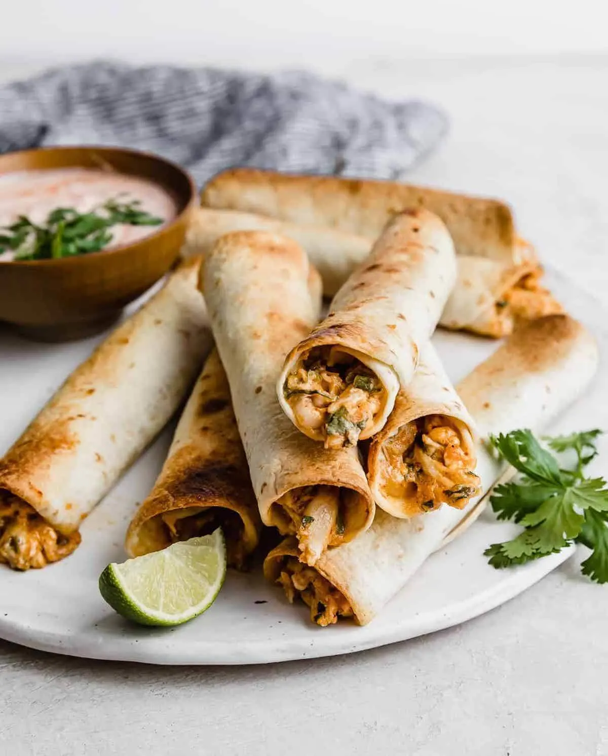 Baked chicken taquitos on a plate