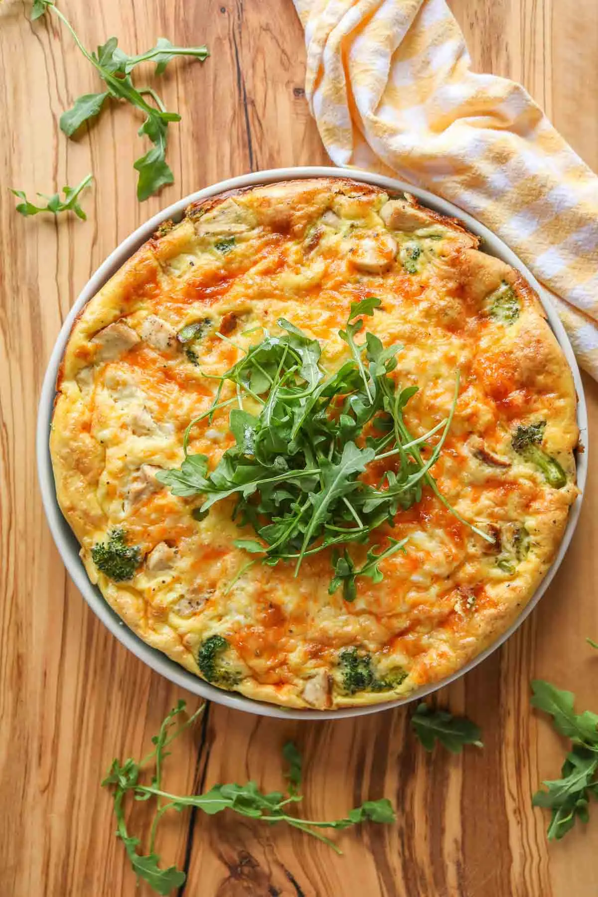 Broccoli chicken frittata in a baking dish on a table