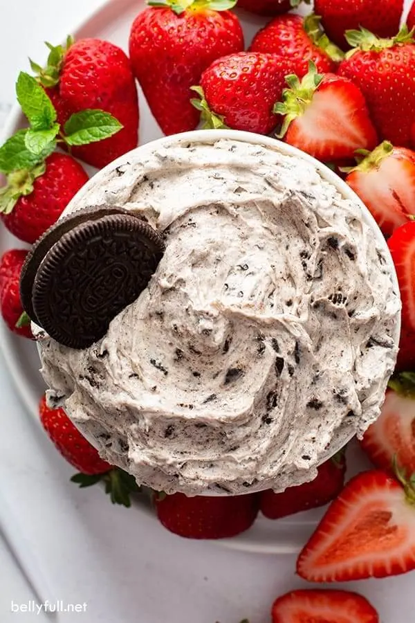 Oreo cookie dip on platter with strawberries