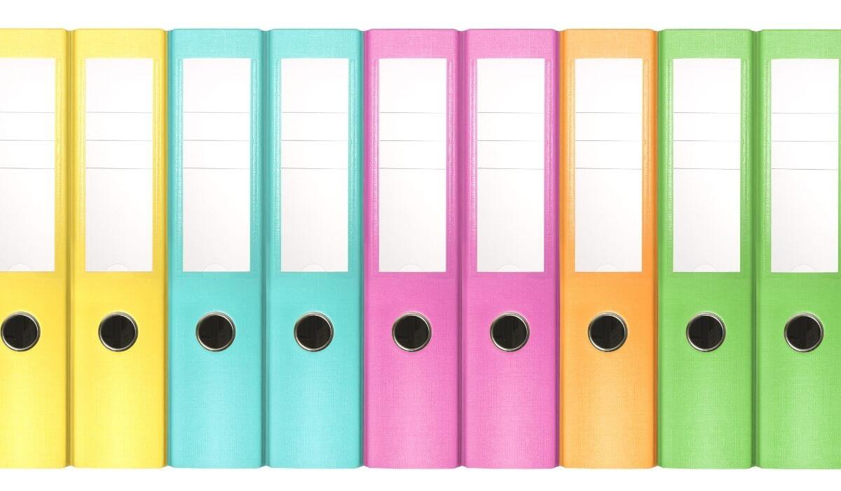 Colourful binders on a shelf