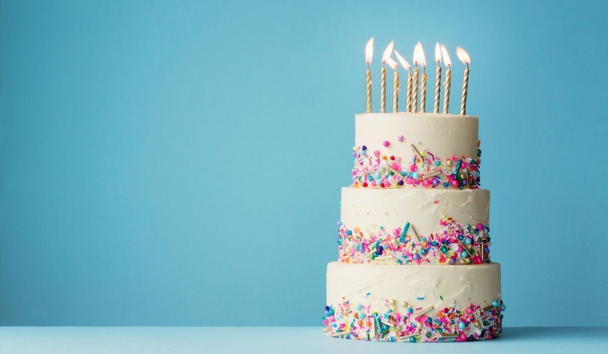 3 tier birthday cake with sprinkles