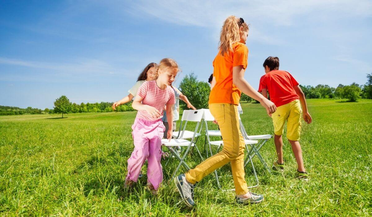 Kids playing musical chairs outdoors