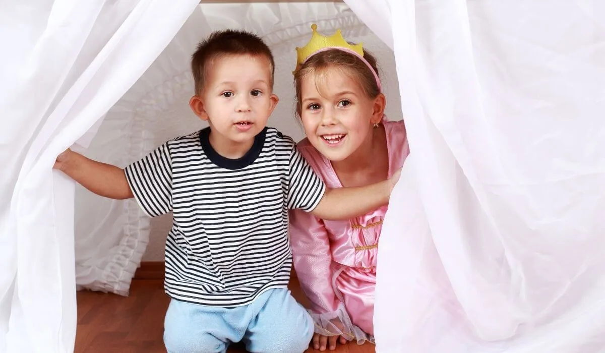 Two kids hiding during a game
