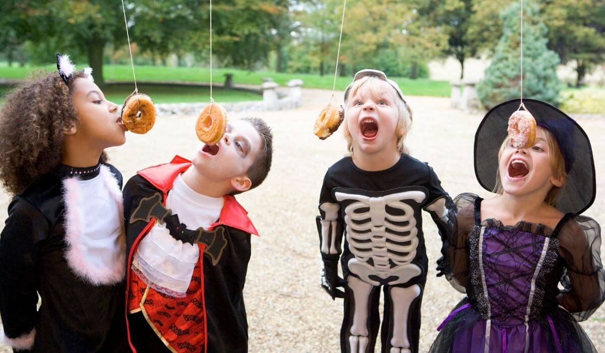 Hanging donuts game at a halloween kids party