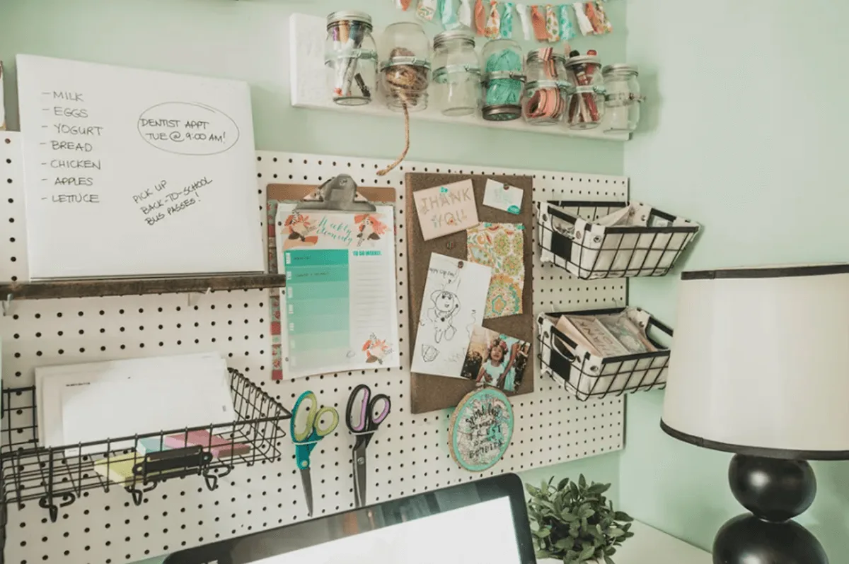 Pegboard family command center in craft room area
