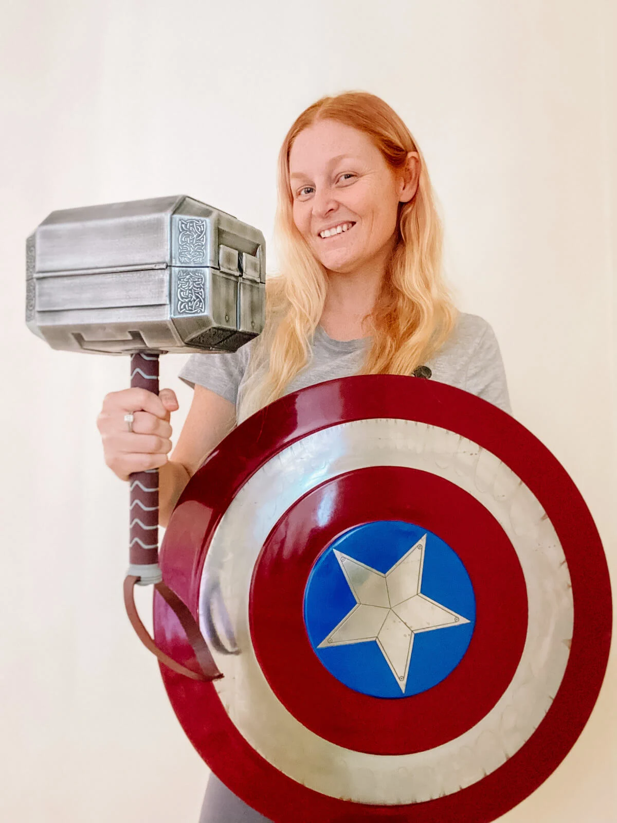 Holly with marvel cosplay captain america shield and thor hammer
