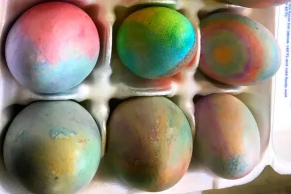 Easter eggs in carton decorated with crayons
