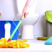 woman mopping bathroom floor